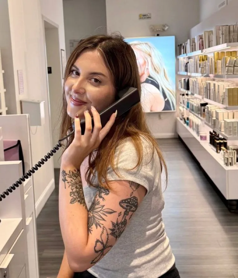 Front desk team member assisting a guest at Charles David Salon